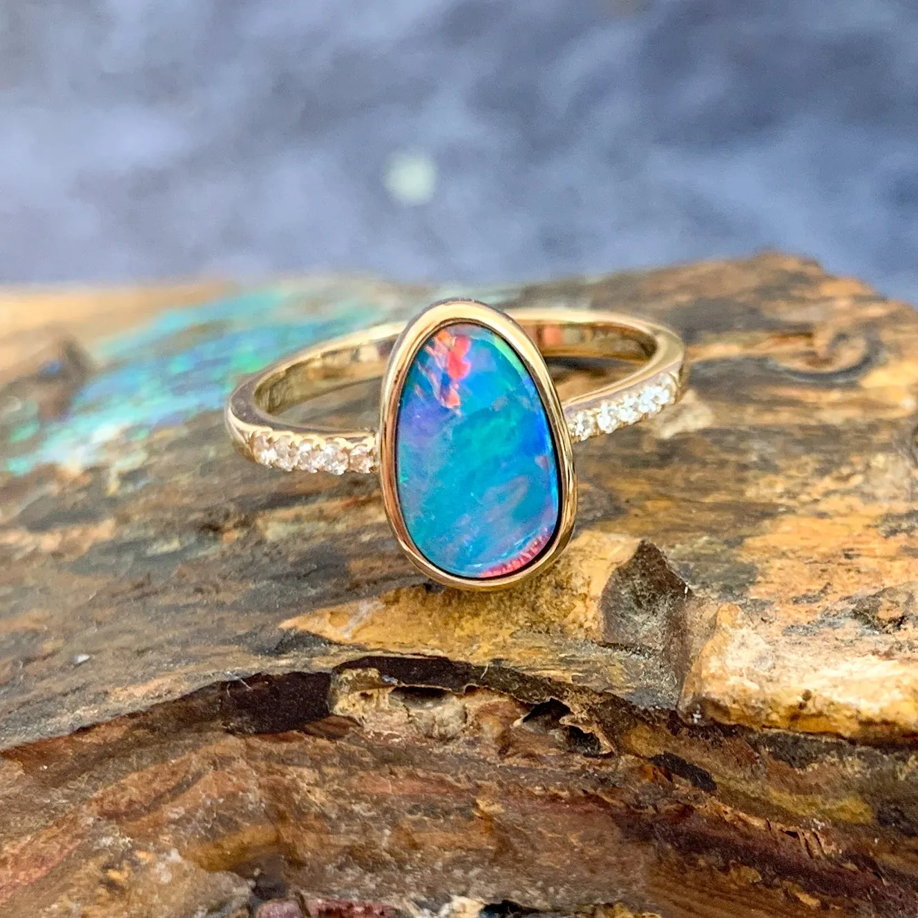 14kt Yellow Gold Opal doublet red green flash and diamond band ring